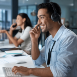 An image of man guiding his workers on help desk operations