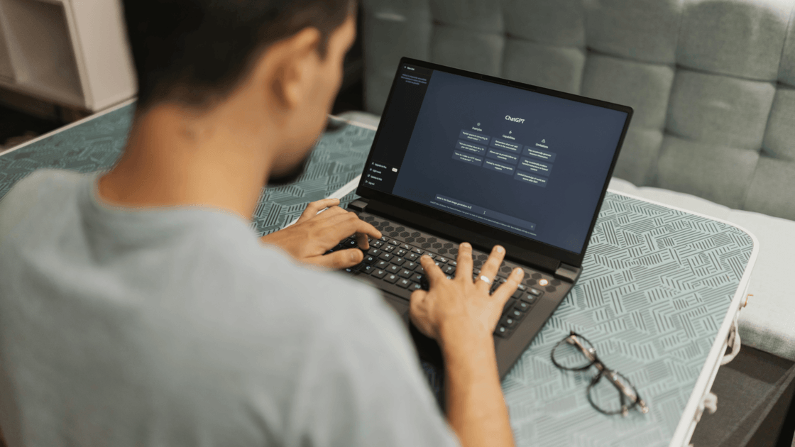 Professional working on a laptop displaying AI, data and machine learning analytics
